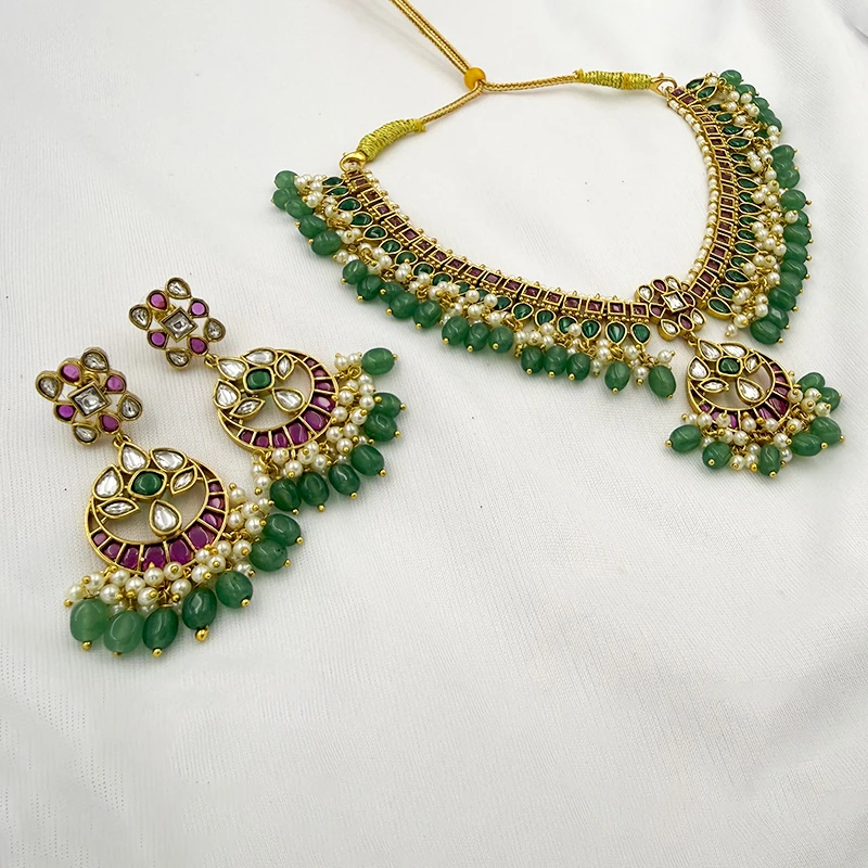 Kundan Pearls Necklace Set with Emerald & Ruby Stones